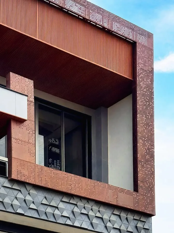 Terracotta perforated cladding with LED