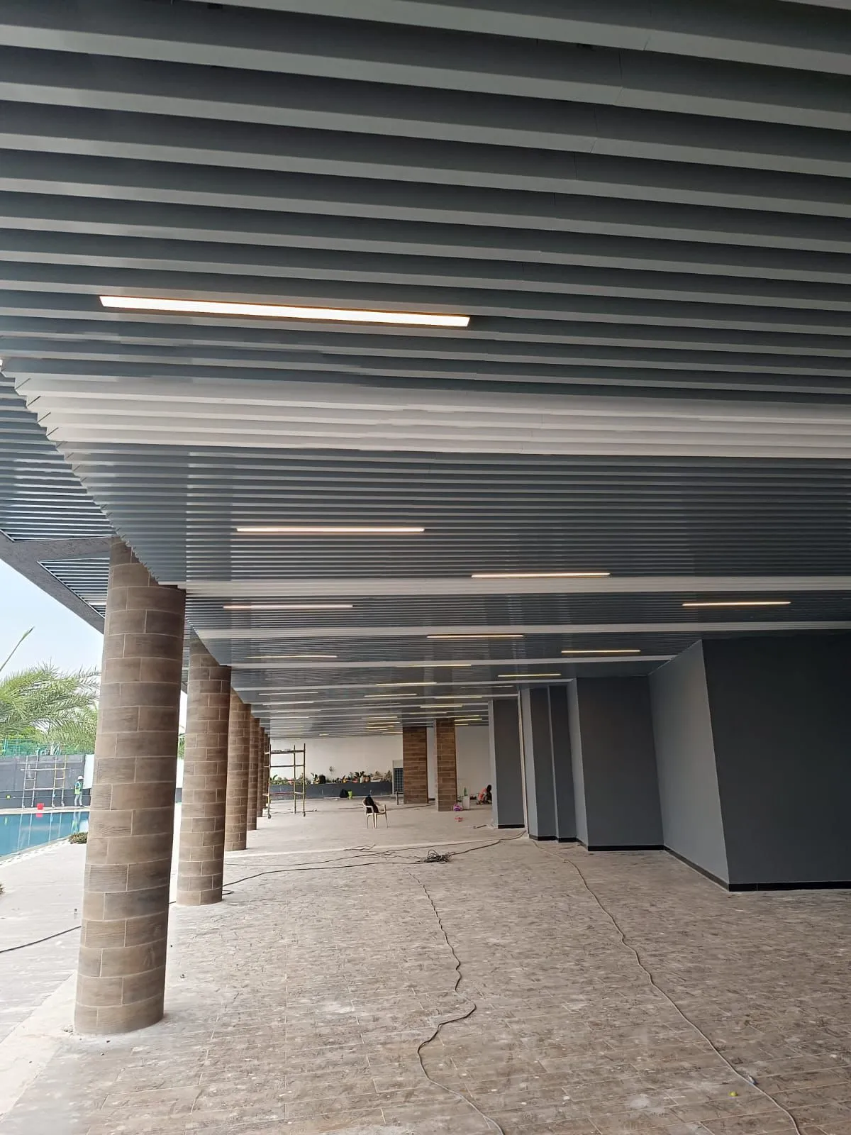 Decorative wooden ceiling with metal strip pattern